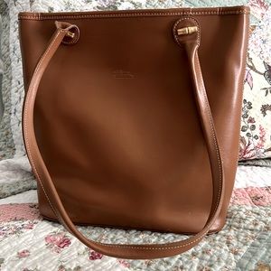 Longchamp tote was used for a month until I decided it was too big.